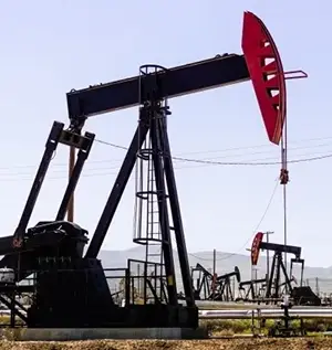 An oil pumpjack operating in a field